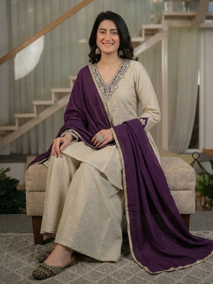 Regal Cream Silk Peplum Kurti and Flared Palazzo Suit Set Adorned with Ornate V-Neck Embroidery and a Rich Plum Purple Dupatta